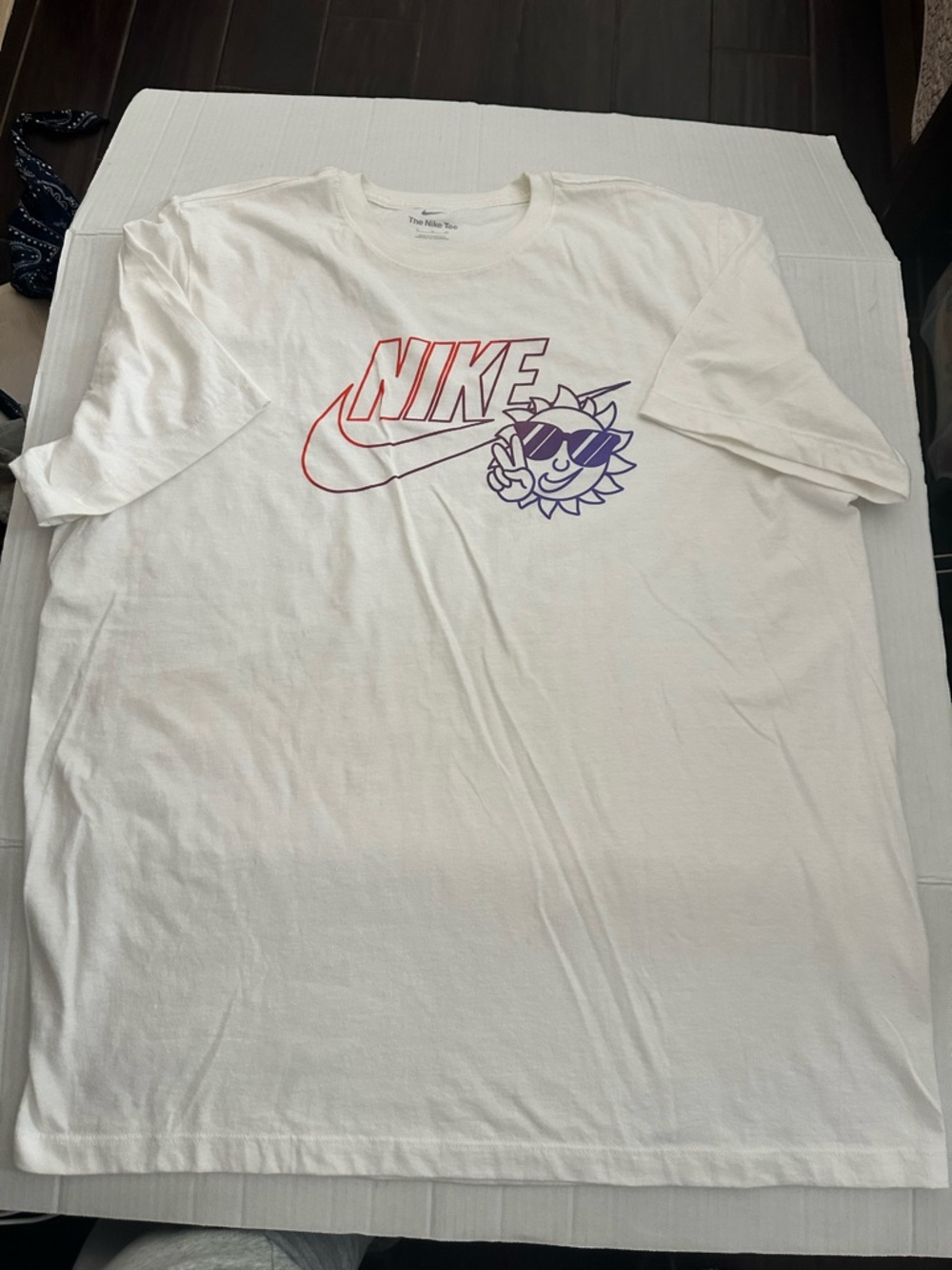 Nike White Short Sleeve T-Shirt with Red Logo and Purple Sun Graphic